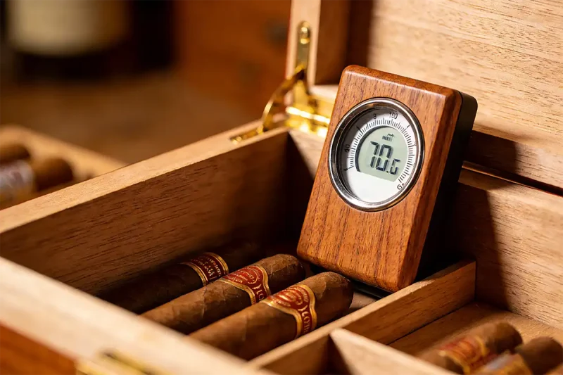 digital hygrometer inside cigar humidor showing accurate humidity reading