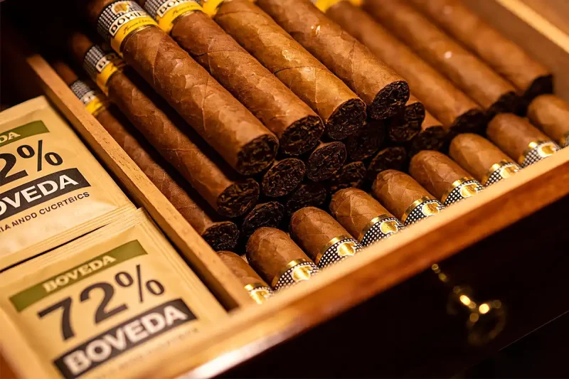 full desktop humidor with cigars and Boveda packs for stable humidity